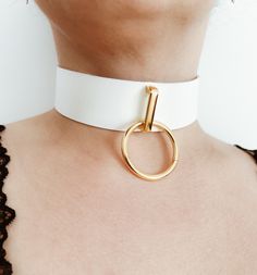 * Women's genuine leather choker with o ring * Choker wide is 3 cm (1.18inch) * 30mm (1.18inch) o ring in gold with gold arch * Can be used with leash * Please see the size chart in photos Chic White Choker Jewelry, Trendy White Metal Choker, Minimalist White Choker For Everyday, Minimalist White Everyday Choker, Everyday Minimalist White Choker, White Minimalist Metal Jewelry, Minimalist White Metal Jewelry, White Metal Choker Jewelry, Sub Collar