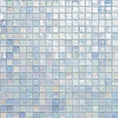 a blue and white mosaic tile wallpaper with small squares on the bottom, in different shades