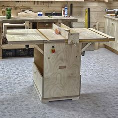 a workbench in a wood shop with lots of tools on the counter top