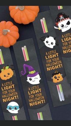 three halloween bookmarks with little light for your halloween night written on them and two pumpkins in the background