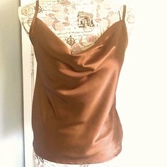 Nwt. Very Similar To The $90 Tank By Ekouaer. This Tank Top Is A Bronze-Brown Color In A Satiny Smooth Luxe Fabric That Looks Like Silk. It Has A Fluid Cowl Neckline And Adjustable Spaghetti Straps. Unlined. 100% Polyester. No Stretch. Should Be Hand Washed. Measures Approximately: 17” Across Armpits 21-22”Long From Mid-Strap 12.5” Long From Armpit Side 18” Wide At Base Brown Fitted Top With Spaghetti Straps, Brown Fitted Spaghetti Strap Top, Brown Fitted Cami Tank Top, Chic Fitted Brown Camisole, Brown Fitted Camisole, Fitted Brown Camisole, Fitted Brown Camisole With Built-in Bra, Sleeveless Brown Tank Top For Night Out, Brown Sleeveless Tank Top For Night Out