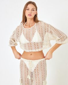 Ooh la la...we're all about the lace! The Gigi Top is the cutest little crop with a three-quarter sleeve and detailed Ibiza Lace fabric. Pair it with the coordinating Sundown Pant to make a set that will take you from day to night. Crop Top 3/4 Sleeve Ibiza Lace Size XS-XL, 1X-3X 86% Polyester / 14% Cotton Style # GGITP24A Model Measurements: Daria, size S - Height 5’9.5”, Bust 34, Waist 24.5, Hips 36 Cropped Lace Top With Crochet Details, Lace Cropped Crop Top For Beach, Lace Cropped Top For Beach, Cropped Lace Crochet Top, White Cropped Lace Crochet Top, Lace Crop Top With Lace Trim For Vacation, Cropped Crochet Lace Top, Beach Open Knit Long Sleeve Crop Top, Beach Long Sleeve Open Knit Crop Top