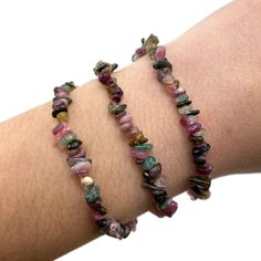 "This listing is for one (1) rainbow tourmaline chip bracelet. These are stock photos in which you will be hand selected a bracelet. These are one size: \"one size fits all\" These are best suited for wrists measuring 5.5-7 inches in diameter. They do stretch quite a bit past that as well (if needed). (I have quite small wrists and they fit me fine, they are not too loose though; my wrists are shown in the picture). They are strung on elastic string in order to fit almost any wrist size! These b Handmade Adjustable Tourmaline Bracelets, Multicolor Tourmaline Bracelet, Elegant Rainbow Multi-stone Bracelets, Multicolor Multi-stone Adjustable Crystal Bracelet, Bohemian Multicolor Hand-strung Crystal Bracelet, Animal Bracelet, Tourmaline Bracelet, White Gold Bracelet, Tourmaline Gemstone