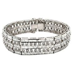 Experience the pinnacle of luxury with our 17.2 carat natural diamond link bracelet. Crafted from 18k white gold, it features 375 baguette and 100 round cut diamonds arranged in a five-row design. Unisex and weighing 68 grams with a width of 17.6mm, it offers excellent wrist coverage. This timeless statement piece is perfect for any formal occasion. Details: - Metal: 18k White Gold - Weight: 68 grams - Width: 17.6mm - Thickness: 4.1mm - Length: 7.5 inches Diamond Details: - Baguette Cut Diamonds Baguette Cut Diamond, Baguette Cut, 2 Carat, Round Cut Diamond, Formal Occasion, Link Bracelets, Baguette, Round Cut, Natural Diamonds