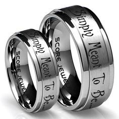 two wedding rings with engraved names on them