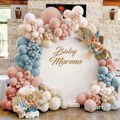 a baby shower is decorated with balloons and flowers