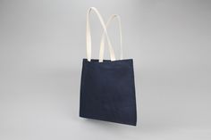 "The Standard Tote is made to last. Unlike most cheaply made tote bags, The Standard is made of heavy canvas with thick, high-quality handles, and waxed by hand so you can use it again and again. Its deceptively simple design provides clean, modern lines and maximum durability. Features handles with enough length to comfortably fit over your shoulder, and an extra roomy interior. It's your new go-to bag. You could even say it sets the...Standard. Also available in 6 other Italic Home colors, wit Blue Cotton Bags With Leather Handles, Everyday Navy Bag With Handles, Everyday Navy Bags, Blue Canvas Bag With Leather Handles For Shopping, Everyday Blue Canvas Bag With Reinforced Handles, Blue Canvas Bag With Reinforced Handles For Everyday Use, Blue Rectangular Canvas Bag With Reinforced Handles, Navy Cotton Canvas Bag For Everyday, Everyday Navy Cotton Canvas Bag