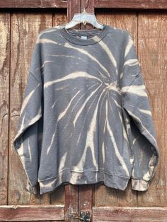 Gray Bleach Dyed Sweatshirt // Bleached Tie Dye // Bleached Loungwear // Grey Acid Washed Sweatshirt Sit back and relax in our comfy sweatshirts. Our sweatshirts are gently hand bleached to create a unique design using a reversed process rather than adding color. This charcoal color shows tones of bronze and heather grey when the color is removed. Each of our items are made to order, and there may be slight variations in design. The process we use to remove the color will ensure your clothing st Stonewashed Relaxed Fit Sweatshirt For Fall, Fall Stonewashed Relaxed Fit Sweatshirt, Relaxed Fit Cotton Stonewashed Sweatshirt, Cotton Stonewashed Relaxed Fit Sweatshirt, Relaxed Fit Acid Wash Sweatshirt, Stonewashed Cotton Sweatshirt In Relaxed Fit, Relaxed Fit Cotton Tie-dye Sweatshirt, Tie Dye Cotton Sweatshirt Relaxed Fit, Relaxed Fit Tie Dye Cotton Sweatshirt