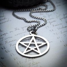 A classic witch amulet, a must!In many old grimoires dealing with magical evocation, the pentacle is described as being hung about the neck, providing protection and authority to the operator.I wear this with one or 2 other necklaces, it's really easy to layer and match with other tribal-witchy pieces. Pendant measures 25 mm in diameter and hangs on a curb chain. Sterling silverHandcraftedOxidized finish Witch Amulet, Witch Pentacle, The Pentacle, Pentagram Jewelry, Pentacle Necklace, Pentagram Necklace, Witch Fashion, Silver Signet Ring, Ring Photos