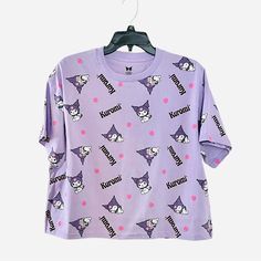 Sanrio Kuromi All Over Print Purple Cropped T-Shirt Condition: Brand New Without Tags Note: Please View All Photos Carefully For Item Description. Thank You. Purple Short Sleeve Top With All Over Print, Casual Purple Tops With All Over Print, Casual Purple Top With All Over Print, Purple Graphic Print Tops For Loungewear, Cute Purple Tops With Relaxed Fit, Purple T-shirt For Summer Loungewear, Summer Purple T-shirt For Loungewear, Cotton Tops With All Over Print For Loungewear, Printed Short Sleeve Tops For Loungewear