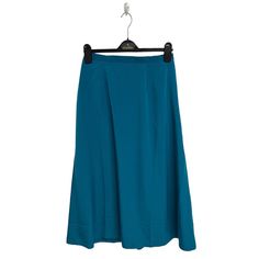 Vintage Graver Studio Women's Long Teal Blue A-Line Skirt Size M Material:100% Polyester Measurements Approx.: All Measurements Are Taken With Garment Flat And Doubled When Necessary. Waistline: 26"Inches Hips: 43"Inches Length Skirt: 34"Inches Please See Photos And Measurements For Exact Condition And Details, Every Designer Has Different Standards For Sizing. We Will Combine Shipping Cost. Reasonable Offers Will Be Accepted Immediately. We Try Our Best To Give The Exact Color In The Photos. Us Blue Stretch Midi Pencil Skirt, Blue Stretch Skirt For Workwear, Blue Pleated Pencil Skirt, Blue Summer Workwear Skirt, Blue Flared Pleated Skirt For Work, Blue Fitted Midi Skirt, Fitted Blue Midi Skirt, Blue Midi Pencil Skirt For Summer, Blue Workwear Skirt For Summer