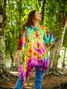 Indulge in the unique charm of our hand-dyed tunic top, meticulously crafted for those who appreciate exceptional fashion. Made from 100% breathable and comfy rayon, this stunning piece is designed to elevate your style while ensuring absolute comfort. Our tunic top stands out with its one-of-a-kind hand-dyed method, guaranteeing that no two pieces are exactly alike. Embracing a loose silhouette, it offers a versatile fit that flatters a wide range of sizes, from S to 2XL. With its side-stitched Bohemian Colorful Poncho For Festival, Bohemian Style Colorful Festival Poncho, Bohemian Colorful Festival Poncho, Multicolor Summer Festival Poncho, Summer Festival Multicolor Poncho, Tie Dye Tunic Kaftan For Festival, Free Size Tie Dye Kaftan For Festival, Festival Tie Dye Tunic Kaftan, Bohemian Hand Dyed Kaftan For Festivals