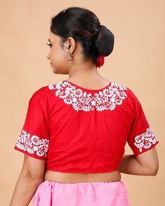 a ready-made, pure cotton, embroidered design blouse. These types of blouses are popular for their comfort and aesthetic appeal, especially in traditional and ethnic wear.  Blouse available in 32,34 waist size waist-32 =36 Bust waist-34=38 Bust Embroidered Short Sleeve Traditional Wear For Festivals, Short Sleeve Embroidered Traditional Wear For Festivals, Red Chikankari Embroidery Blouse Piece, Short Sleeve Blouse Piece With Floral Embroidery For Festivals, Festivals Blouse Piece With Floral Embroidery And Short Sleeves, Traditional Short Sleeve Sets, White Cotton Blouse With Pallu, Traditional Red Top With Chikankari Embroidery, Festive Red Chikankari Embroidery Blouse