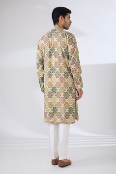 Multicolored green bandhani kurta highlighted with sequin embroidery. Paired with a cotton silk pant. - Aza Fashions Green Bollywood Sherwani In Chanderi Fabric, Bollywood Style Green Chanderi Sherwani, Green Bollywood Style Chanderi Sherwani, Bollywood Green Chanderi Sherwani, Designer Bandhani Print Kurta For Festivals, Festival Designer Kurta With Bandhani Print, Traditional Sherwani With Bandhani Print For Navratri, Traditional Bandhani Print Sherwani For Navratri, Traditional Bandhani Sherwani For Navratri