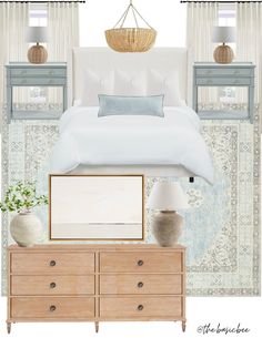 a bedroom with white bedding, blue and beige accessories and decor on the walls