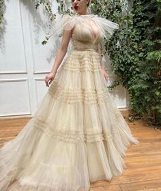 A-line Tulle Gown With Sweep Train, V-neck Tulle Gown For Debutante Ball, Tulle V-neck Gown For Debutante Ball, V-neck Tulle Evening Dress For Debutante Ball, Beige V-neck Evening Dress For Wedding, A-line Tulle Evening Dress With Ruffles, Tulle A-line Ball Gown With Fitted Bodice, A-line Tulle Ball Gown For Evening, A-line Tulle Gown