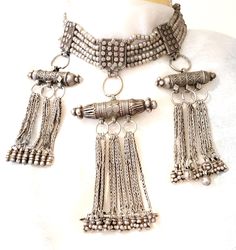 "Beautiful Antique Yemenite Multi-strand Beads Necklace Silver Bedouin Kirdan necklace from Yemen. The necklace features Lazem or Kirdan design ; multipe strands of  beads are strung through 5 box plaques, finely decorated with applied granulation and lozenges. They hold tubular amulets.. Excellent quality of workmanship for this early XX century piece. with fine silver detail and a Beautiful Beads with Silver Dangles,unique piece from the earliest 1900s This is an example of the most delicate workmanship.item is individually handcrafted by local artisans in Yemen vintage item which may reflect signs of usage and wear. in very good condition This piece of Bridal Dowry is rare and would be a great piece on any exclusive ethnic jewellery collection measures 18\" x 3'' x 6'' includes Dangle B Silver Beaded Temple Necklace For Festivals, Festival Silver Beaded Temple Necklace, Bohemian Necklace With Silver Beads For Ceremonial Use, Traditional Silver Beaded Temple Necklace, Bohemian Sterling Silver Temple Necklace With Intricate Design, Silver Bohemian Choker For Ceremonial Occasions, Traditional Silver Beaded Necklace With Intricate Design, Traditional Silver Long Beaded Necklace, Silver Beaded Necklace With Intricate Design For Festivals