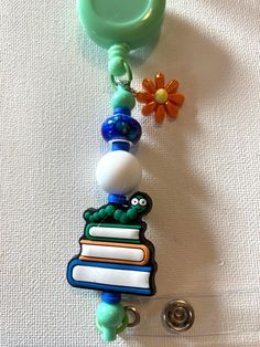 Light Green Handmade Beaded and Silicone badge holder. With silicone book worm and coordinating beads. Great for back to school for that special teacher or student to hold ID badge.  item not suitable to small children or pets due to possible choke hazard. Handmade Multicolor Craft Supplies For School, Multicolor Handmade Craft Supplies For School, Novelty Adjustable Badge Holders For School, Silicone Light, Book Worm, Badge Holder, Id Badge, Badge Holders, Book Worms