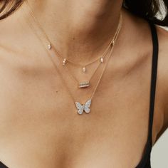 Butterflies always remind us to pause and notice the world around us. Featuring beautiful brilliant diamonds of various sizes, our 14K Gold Diamond Butterfly Necklace catches your eye with its exquisite sparkle. This necklace truly has us all aflutter for butterflies. It can be worn at 16", 17" and 18".Layer our Diamond Ombré Butterfly Necklace with our Diamond Charm Necklace. 0.91 carats diamonds SBN76-YG-WD All sales are final. Diamond Butterfly Necklace, Diamond Charm Necklace, Diamond Butterfly, Diamond Stacks, Gold Ear Cuff, Butterfly Pendant Necklace, Ear Cuff Earings, Diamond Charm, Diamonds And Gold