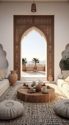 a living room filled with lots of furniture next to an open doorway that leads to the beach