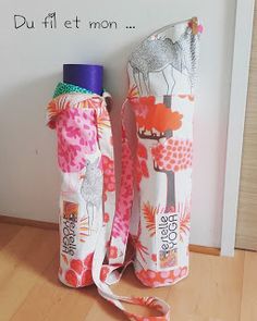 two reusable water bottles sitting next to each other on a wooden floor with the words du filt et mon