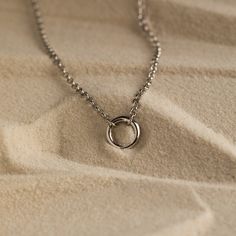 Introducing our Minimalist Circle Necklace, designed with a distinctive Rolo Link Chain that effortlessly exudes a charming and minimalist look. Its versatile hinged circle can be easily detached, offering the freedom to customize your style as you see fit ♡ Layer it with any other necklace or chain of your choice as its simple, yet classic style makes it a staple piece for both casual and formal occasions! Material: High Quality Solid 925 Sterling Silver Finish: Sterling Silver ∙ 18K Gold Featu