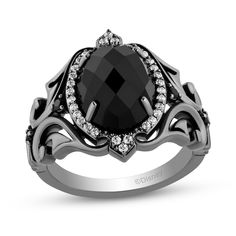 Dare to be different with this spellbinding onyx and diamond ring from the Enchanted Disney Villains Collection inspired by Maleficent. Sterling silver with black rhodium plate The 12.0 x 9.0mm oval-shaped rich black onyx glistens in a halo of diamonds with crown-like details The ornate shank features sculpted scrolling ribbons and black diamonds 1/5 ct. t.w. of diamonds Available in size 7 only ©Disney Unique Engagement Rings Black, Gothic Jewelry Rings, Black Gold Engagement Rings, Hand Decor, Goth Ring, Enchanted Jewelry, Enchanted Disney, Frame Ring, Gothic Ring