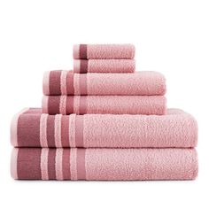 pink towels stacked on top of each other