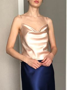 This silk satin top can be worn as a party and date dress and for many other occasions. Made of satin silk.  DESCRİPTİON:  -Adjustable straps.  -Designed for a slim but relaxed fit.  -Unlined. İt is a custom made top tailored according to your preferences. While ordering write your bust and waist measure, so the top will be made to your size. Please enquire if you're interested in different color. SIZING INFO: XS/34/US4: bust: 82-86cm (32-33 inch) waist 64-66 cm (24-25 inch)  S/36/ US6: bust: 86-88cm (33-34 inch) waist: 66-68 cm (25-26 inch) M/38/ US8: bust: 88-92 cm (34-36 inch) waist: 68-72 cm (26-28 inch) L/40/ US10:  bust: 92-94 cm (36-37 inch) waist: 72-74 cm (28-29 inch) WASH and CARE: Hand wash. Iron at high heat. Don't hesitate to contact me with any question or thought, I'd love t Cami Top With Built-in Bra For Evening, Summer Party Camisole With Built-in Bra, Satin Tops For Party, Elegant Satin Camisole With Built-in Bra, Summer Party Tops With Sheen, Satin Party Tops With Built-in Bra, Satin Camisole Slip Dress For Party, Party Satin Camisole Slip Dress, Camisole Slip Dress With Built-in Bra For Night Out