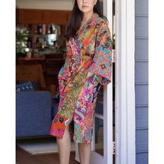 This is a washable printed batik robe/ kimono handmade by artisans. Two side pockets. Removable waist tie closure. Belt loops and inside ties to secure closure. Side slits at hem. Machine washable in cold and machine dry in delicate setting. This is made of printed batik fabric and not wax and dye batik fabric. The kimono robe is made of patchwork quilted batik printed fabric and it is thick. Bungalow Rose | Bungalow Rose Varian 100% Cotton Quilt Mid-Calf Bathrobe w / Pockets Patchwork Quilted 4 Spring Kimono With Relaxed Fit, Multicolor Batik Print Kimono For Spring, Spring Multicolor Kimono With Batik Print, Multicolor Cotton Kimono With Batik Print, Multicolor Kimono With Kimono Sleeves, Multicolor Bohemian Kimono For Home, Multicolor Summer Robe For Home Use, Bohemian Robe With Relaxed Fit And Kimono Sleeves, Summer Batik Print Long Sleeve Kimono