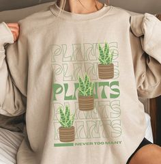 This design is for anyone with a green thumb, people who love plants or gardening. A great gift for plant enthusiasts out there. *This sweatshirt is printed in the United States* *Made from 50% Cotton and 50% Polyester* Our sweatshirts are unisex. Please refer to the size chart in the picture for sizing.  For sweatshirt care, we recommend that you machine wash: warm; non-chlorine bleach as needed; Tumble dry: medium heat; Do not iron; Do not dry clean.  We print our sweatshirts as customers orde Plant Lover Cricut, Cheap White Shirt With Plant Print, Cheap White Shirt With Plants Print, Cheap Women's T-shirt With Plant Print, Cheap Graphic Tee With Plants Print, Trendy Plants Print Shirt, Cheap Crew Neck Top With Plant Print, Cheap Casual Tops With Plant Print, Cheap Women's Tops With Plant Print