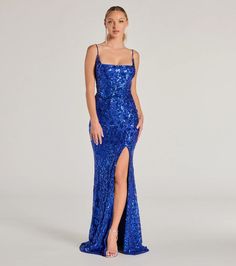 Embellished with light-catching sequins, the Kailani formal long dress is sure to stun at school dances and black tie soirees! She features a square neckline, adjustable spaghetti straps for a customizable fit, a mermaid silhouette that hugs your curves, and a high front slit and graceful floor-length hem for a touch of sultry. The formal maxi dress is crafted with a sequin scroll pattern on mesh fabric and has a full stretchy knit lining. Complete the look in platform heels.Shop Short Version: Leila Sequin Bodycon Mini DressFit & FeaturesSleeveless square necklineAdjustable spaghetti strapsBack zipper and hook-eye closureMermaid silhouette, high front slit, floor-length hemSequin scroll pattern, mesh fabric, full stretchy knit liningStrapless bra recommendedRuns true to size Formal Long Dress, Windsor Dresses Prom, Formal Maxi Dress, Scroll Pattern, Dresses Royal, School Dances, Maxi Dress Formal, A Mermaid, Mermaid Dress