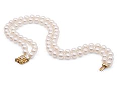 Comprising two pearl strands, measuring 8.5 to 8.9 mm, to an 18k gold clasp, the clasp with a bezel-set princess-cut diamond bordered by round diamonds.