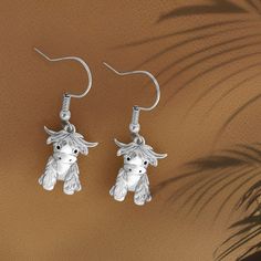 Highland Cow Earrings - These charming earrings are inspired by the adorable shaggy Highland cows of Scotland, bringing a touch of rustic charm to your jewelry collection. Perfect for animal lovers, these earrings showcase the iconic Highland cow design, making them a whimsical and playful accessory to showcase your love for these gentle creatures. Easy to Put On and Take Off - Designed for convenience, these earrings feature a practical hook closure, making them effortless to put on and rem... Whimsical Silver Earrings For Birthday, Whimsical Silver Earrings For Gift, Personalized Silver Earrings For Birthday Gift, Silver Hypoallergenic Earrings For Birthday Gift, Cow Earrings, Wedding Cord, Birthstone Necklace Mothers, Cow Design, Highland Cows