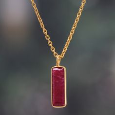 Whether elevating an elegant evening ensemble or adding regal polish to casual day wear, this modern pendant necklace is sure to be your new favorite accent. Indian artisan Neetu Barathi's impeccable design lets a striking rectangular ruby gemstone take center stage complemented by an adjustable 18k gold-plated cable chain that drapes flawlessly. Bring bold sophistication to your look with this stunning accessory filled with color and vibrancy. Elegant Rectangular Pendant Necklace With Polished Finish, Elegant Necklace With Rectangular Pendant And Polished Finish, Elegant Necklace With Polished Rectangular Pendant, Elegant Polished Rectangular Pendant Necklace, Formal Necklace With Delicate Chain And Rectangular Pendant, Gold Plated Rectangular Pendant Necklace For Formal Occasions, Formal Necklace With Rectangular Pendant And Polished Finish, Formal Necklace With Rectangular Polished Pendant, Gold Plated Necklace With Rectangular Pendant For Formal Occasions