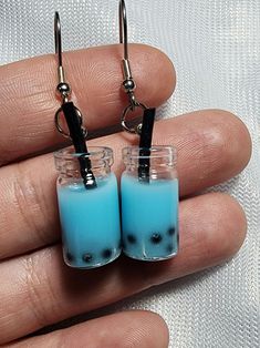 Blue Bubble /Boba Tea Earrings.  What's your favorite flavor? BlueBerry or  Blue Raspberry?? A great gift for any foodie! Other Colors are Available! Earrings are hypoallergenic surgical steel, nickel and lead free. Handcrafted in Florida, USA By K3CreationsUSA  Artist H. Smithgall  Please check out our other listing. Custom orders are available. Items purchased together will recieve combined shipping. Each package contains the pair(s) or earrings placed in a small gift organza pouch & shipped i Handmade Blue Novelty Earrings, Blue Handmade Novelty Earrings, Tea Earrings, Bubble Boba, Boba Bubble Tea, Organza Pouch, Blue Food, Jewelry Accessories Ideas, Boba Tea