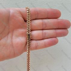 "All Our Jewelry Is MADE OF 100% REAL GOLD  Stand out with this unique Solid 14k Rose Gold  Miami Cuban necklace featuring a box lock clasp with added safety   14K Solid Rose Gold Miami Cuban Chain Necklace, 6.1MM Thick, 22\" 24\" 26\" Inch, Real Gold, Men  Click For All Our ON SALE items https://www.etsy.com/shop/BrusselsGoldNYC?ref=seller-platform-mcnav§ion_id=1  ⭐ ITEM DETAILS:  ► Metal: Rose Gold ► Solid/ Semi-Solid: Solid ► Width: 6mm ► Length: 22\",24\",26\" ► Closure: Box  6 mm 22\" - 60 gram 24\" - 65 gram 26\" - 70 gram  ⭐ SHIPPING: ► ALL OUR JEWELRY ARE SHIPPED FROM NEW YORK CITY ►FREE SHIPPING on all orders in the US. ► We ship INTERNATIONALLY.  Buyer is responsible for duties and taxes. ► Please send us a contact number for international orders  ⭐ RETURN & EXCHANGE: ► No Hassle Luxury 14k Rose Gold Chain Necklace, Luxury Rose Gold 14k Chain Necklace, Luxury Rose Gold Cuban Link Chain Necklace, Luxury Tarnish Resistant Rose Gold Chain Necklace, Luxury Rose Gold Chain Link Necklace, Luxury Rose Gold Necklace With Curb Chain, Luxury Rose Gold Cuban Link Necklace, Rose Gold Cuban Link Chain Necklace Gift, Luxury 14k Gold Cuban Link Necklace With Box Chain