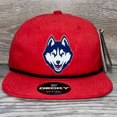 Our 3d Pvc Patch Is A Waterproof, Rugged, And Clean Looking Design. You Can Bet That This Patch Will Look Vibrant For Years To Come. We Only Use The Highest Quality Products And Headwear. We Believe That Our Pvc Patches Beat Out Any Other Type Of Patch Offered On A Hat. Design: Uconn Huskies Hat: Decky Color: Red/ Black Soft-Structured, Five-Panel, High-Profile 70/30 Cotton/Nylon Adjustable Plastic Snapback Slight Curve, Is Adjustable Either Way Hat Size: 7 - 7 3/4 Sporty Red Trucker Hat For Outdoor, Red Baseball Cap Snapback For Outdoor Activities, Red Snapback Baseball Cap For Outdoor Activities, Red Sporty Snapback Hat For Outdoor, Sporty Red Snapback Hat For Outdoor, Red Curved Brim Hats For Outdoor Activities, Red Baseball Cap With Visor For Outdoor, Red Adjustable Snapback Hat For Outdoor Activities, Red Flat Bill Hats For Outdoor Activities