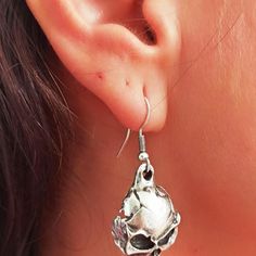 Introducing our Silver Skull Earrings: A daring blend of style and edge. Dangle or hoop they add a touch of mystique to any outfit. Stand out with these unique accessories.• Material: High-Quality Solid 925 Sterling Silver• Finish: Sterling Silver Rose Gold or Gold• A special piece you'll treasure• High-quality materials and attention to detail• Our jewelry is designed With 🖤️ In NY Skull-shaped Metal Earrings, Edgy Pierced Skull Jewelry, Edgy Skull-shaped Pierced Earrings, Metal Skull Single Earring, Earrings Skull, Silver Cleaner, Earrings Hoops, Unique Accessories, Skull Earrings