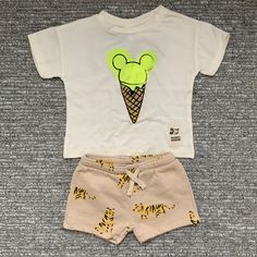 2 New Items With Tags: One Pair Of Shorts And One T-Shirt, Both Size 3-6 Months. Casual Cream Sets For Playwear, Casual Cream Playwear Sets, Playful Cream Cotton Sets, White Cartoon Print Bottoms For Summer, White Fun Cartoon Print Sets, White Fun Sets With Cartoon Print, Zara White Summer Set, Playful White Bottoms With Cartoon Print, Casual White Zara Sets