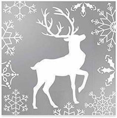 a white silhouette of a deer surrounded by snowflakes