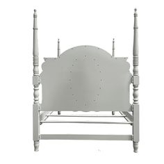 a white bed frame with two posts on each side and a headboard at the end