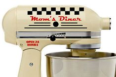 a cream colored mixer with the words mom's diner on it