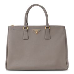 This is an authentic PRADA Saffiano Large Galleria Double Zip Tote in Argilla. This tote bag is crafted of Saffiano crossgrain leather with gold-toned hardware. This bag features rolled leather top handles, base protective feet and the classic gold "Prada Milano" triangle plaque on front. This bag has three compartments, two secured with zippers and an open center compartment with zipper and patch pockets. The spacious interiors are lined with traditional black Prada jacquard logo fabric. Prada Galleria Bag, Prada Tessuto Nylon, Prada Milano, Embroidered Tote Bag, Embroidered Tote, Prada Saffiano, Zip Tote, Large Shoulder Bags, Classic Gold