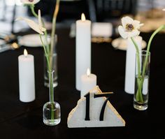 the table is set with candles and flowers