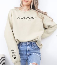 THE PERFECT UNIQUE MOTHER'S DAY GIFT, GET THIS PERSONALIZED MAMA SWEATSHIRT WITH DATE AND KIDS NAME FOR MOM. This Sweatshirt is not only cute and cozy with a personalized touch but, it's a reminder of the cherished moments you share and a gift she will treasure forever.  PRODUCT DESCRIPTION HOW TO ORDER : 1. Please check and review all photos. 2. Select size and color from the drop-down menu. 3. Use the size chart to find the best fit for you.  4. Provide personalization in the personalization box if offered. (name, print color, etc.) 5. Once your item is selected click Add to Cart. To add more shirts simply go back and add more items. 6.  Proceed to check out for payment. MATERIAL: Our sweatshirts have a unisex fit for a relaxed and comfortable fit, but if you're looking for more of an ov Momma Sweatshirt, Mama Design, Unique Mothers Day Gifts, Gifts For Farmers, Mama Sweatshirt, Stay Cozy, Cut And Style, Unisex Sweatshirt, San Jose