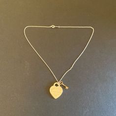 “New” Tiffany Necklace With Gold Key This Is A Vey Nice Piece. Won’t Last Long Make A Deal Today! Tiffany Gold Necklace, Jewelry Tiffany And Co, Tiffany Key Necklace, Cartouche Necklace, Tiffany Gold, Heart Necklace Tiffany, Tiffany Key, Peach Necklace, Tiffany And Co Necklace