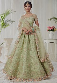 Net Lehenga in Light Green This Attire with Art Silk Lining is Enhanced with Resham, Zari, Sequins and Patch Border Work Available with a Semi-stitched Net Choli in Light Green, Crafted in Sweetheart Neck and Short Sleeves and a Scalloped Net Dupatta in Light Green. Choli Length is 14 to 15 inches and Sleeve Length is 4 to 5 inches This Semi-stitched Lehenga Waist and Hips are Customizable from 28 to 38 and 36 to 46 inches respectively. Its Length is 41 inches Do note: Accessories shown in the घाघरा चोली, Orang India, Indian Bridesmaid Dresses, Sabyasachi Lehenga, Reception Lehenga, Party Wear Lehenga Choli, Bollywood Lehenga, Lehenga Wedding, Green Lehenga