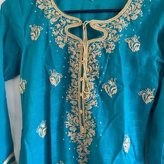 Light Weight Blue Embroidered Kurti, Brand New Never Been Worn. No Pants Or Duppata Included. Bohemian Blue Sets With Floral Embroidery, Bohemian Blue Set With Floral Embroidery, Blue Embroidered Summer Sets, Blue Kurta With Gold Embroidery For Diwali, Blue Traditional Wear With Intricate Embroidery For Spring, Spring Blue Traditional Wear With Intricate Embroidery, Blue Salwar Kameez With Intricate Embroidery For Spring, Blue Floral Embroidery Salwar Kameez For Summer, Blue Floral Embroidered Salwar Kameez For Summer