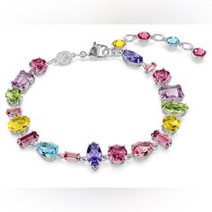 This Joyful, Prismatic Bracelet From The Gema Family Features A Shimmering Mix Of Crystals In The Prettiest Pastel Shades On A Refined Rhodium Plated Setting. The Dazzling Array Of Cuts And Colors Is Arranged In An Organic, Yet Precise, Way Resulting In A Piece Of Unexpected Beauty. Wear This Bracelet Alone Or With Matching Gema Jewelry To Inject Vibrancy Into Your Everyday. Collection: Gema Length (Minimum - Maximum): 6 1/2 - 8 1/8 Inch Width: 3/8 Inch Material: Crystals, Rhodium Plated Color: Elegant Multicolor Crystal Bracelet, Multicolor Crystal Jubilee Bracelet, Elegant Multicolor Crystal Bracelet For Formal Occasions, Elegant Multicolor Crystal Bracelet For Formal Events, Multicolor Crystal Jewelry With Jubilee Bracelet, Elegant Multicolor Crystal Bracelet With Sparkling Stones, Multicolor Crystal Bracelet With Sparkling Stones, Multicolor Sparkling Stones Crystal Bracelet, Multicolor Cubic Zirconia Crystal Bracelet